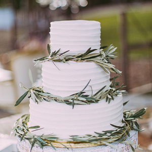 Classic white wedding cake with greenery