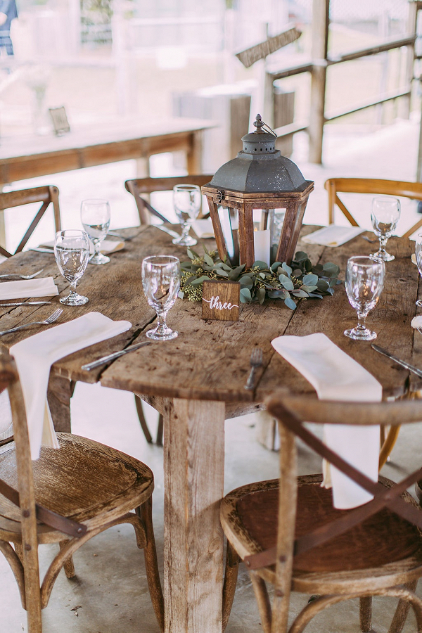 Rustic wedding table with lantern centerpiece