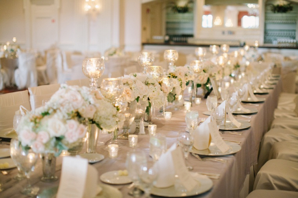 Elegant long table wedding reception with blush and cream florals
