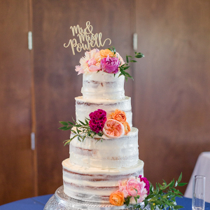 Classic semi naked wedding cake with fresh flowers