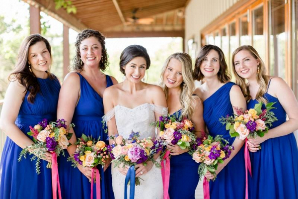Bridesmaids in bright blue dresses