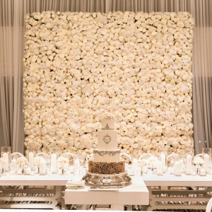 Luxe wedding reception at The Langham Chicago with white rose floral backdrop