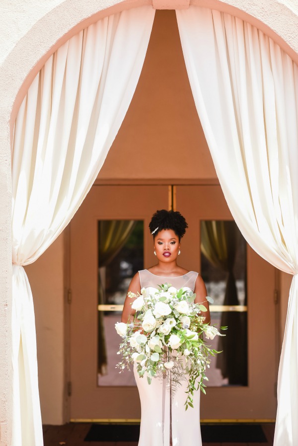 Bride with large greenery bouquet