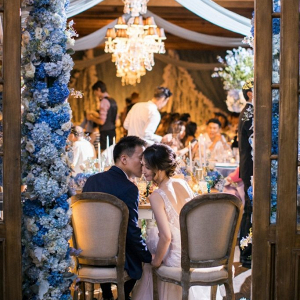 Luxe wedding reception with blue floral decor