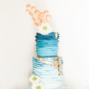 blue and copper wedding cake on Aisle Perfect