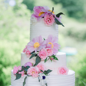 Buttercream wedding cake with pink flowers