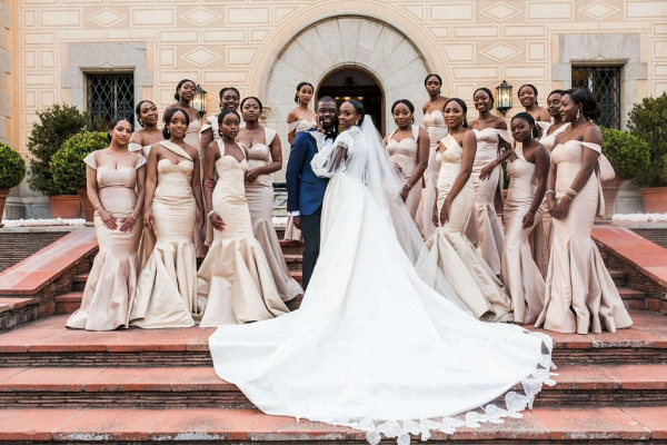 Bridal party in long taupe gowns with bride in long sleeve couture gown