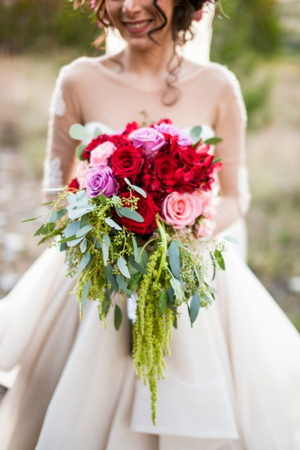 Bride holding trailing bouquet