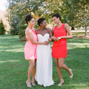 Bride with bridesmaids in bright dresses