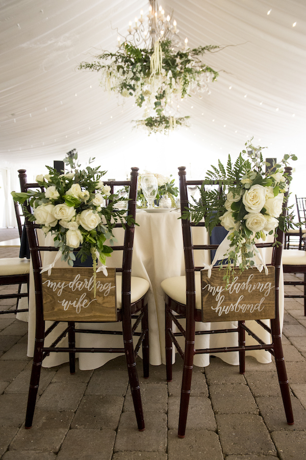 Cheeky Signs Flanked the Bride and Grooms Chairs and the Reception, Adding a Sweet Touch