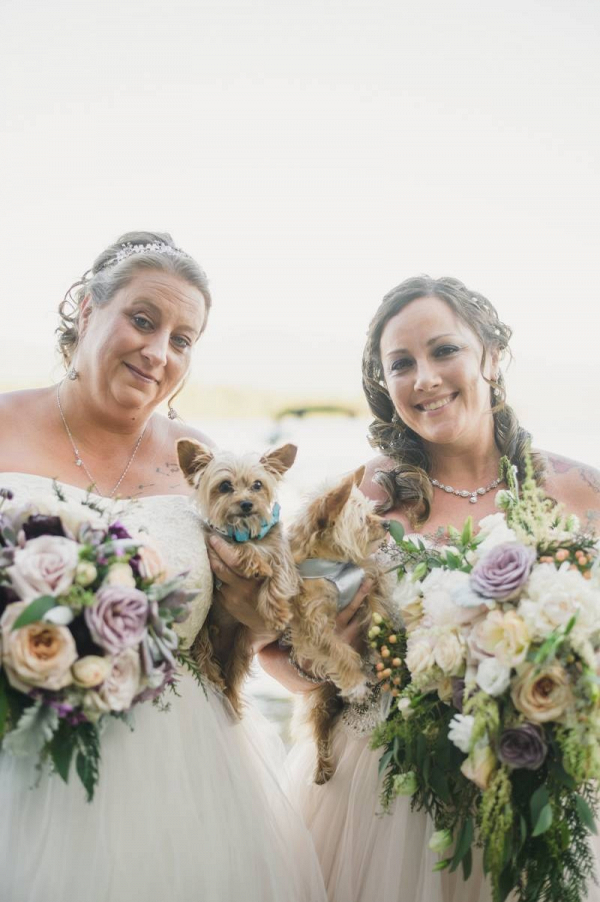 Two brides with their pups