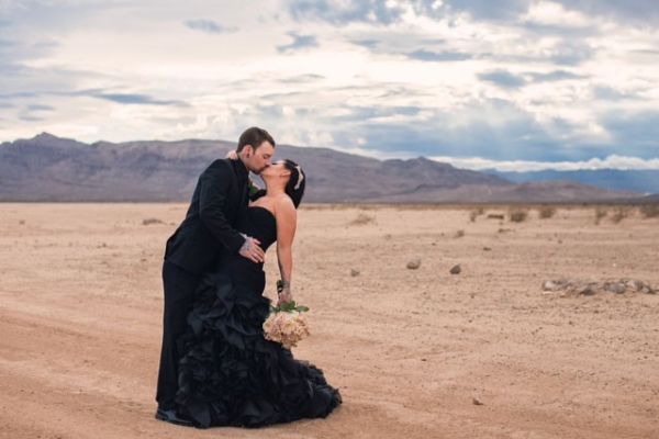 Newlywed portraits in the desert with all black attire for the bride and groom