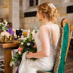 Bride Seated at Victorian Styled Table in Chapel