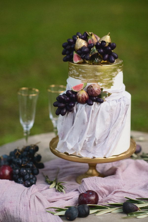Wedding Cake with Golden Details and Fresh Figs and Grapes