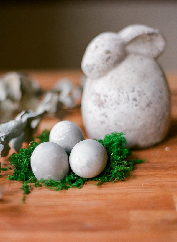 Three Cement Easter Eggs on Fake Grass and Rabbit