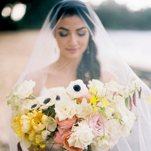 Veiled Bride with Yellow and Pink Bouquet