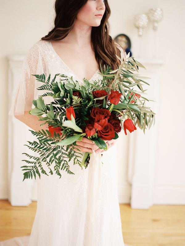 Bride with Bouquet of Red Roses and Tulips