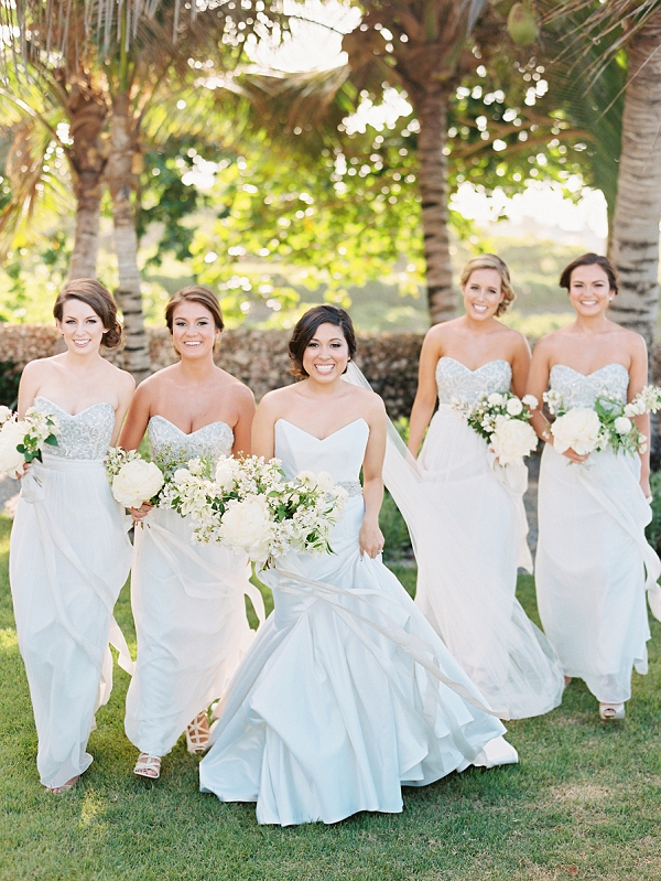 A Bride and Bridesmaids In Strapless Dresses