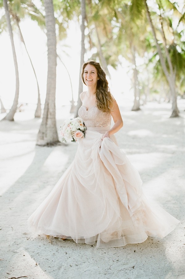 Bride in Blush Corset and Skirt Holding a Pastel Bouquet
