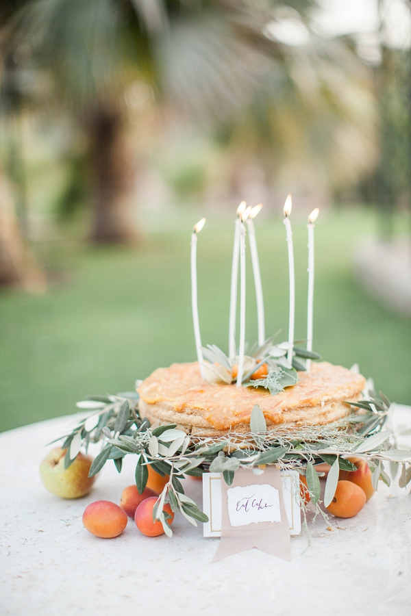Wedding Cake with Greenery and Candles