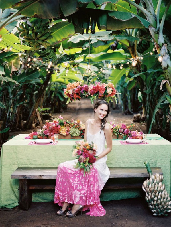 Bride with Bouquet Seated at a Colorful, Tropical Tablescape 