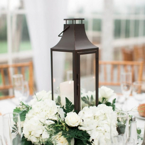 Classic lantern centerpiece with white floral wreath