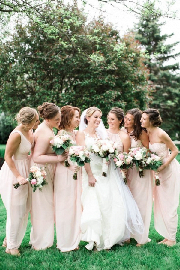 Bridesmaids in long blush gowns