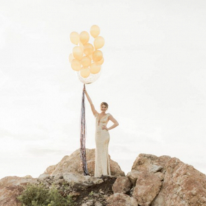Bride in gold sequins with balloons