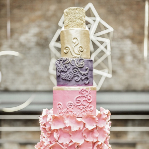Glam gold pink and purple wedding cake