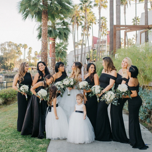 Bridesmaids in long black gowns