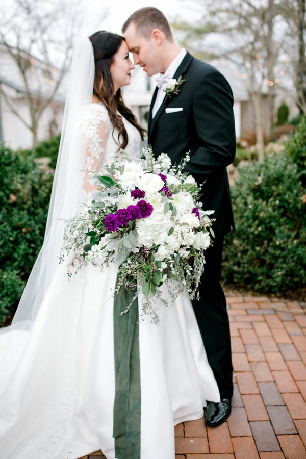 Lush white, purple, and green bridal bouquet
