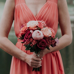 Coral bridesmaid dress and bouquet