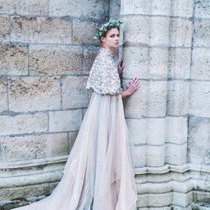Bride in embellished cape by Eva Poleschinski Bridal Couture