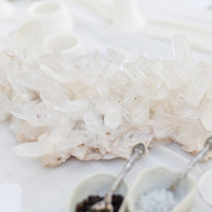 Huge quartz clusters decorate this wedding table setting