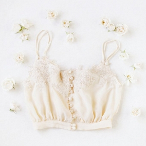 Beautiful silk bridal lingerie by Ailsa Munro, framed by cream roses!