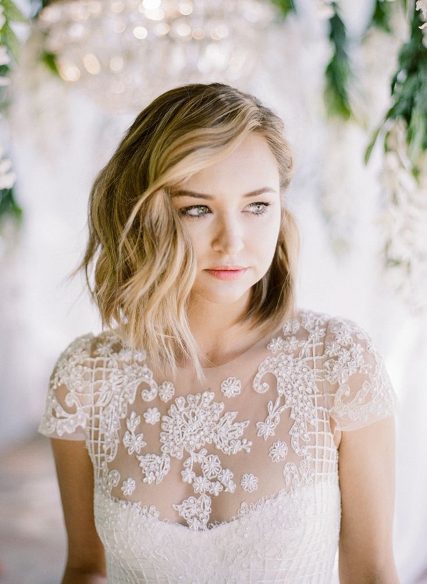 bridal portrait with loose curls and lace embellished wedding gown