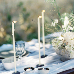 Modern Fine Art tablescape with taper candles and ceramics