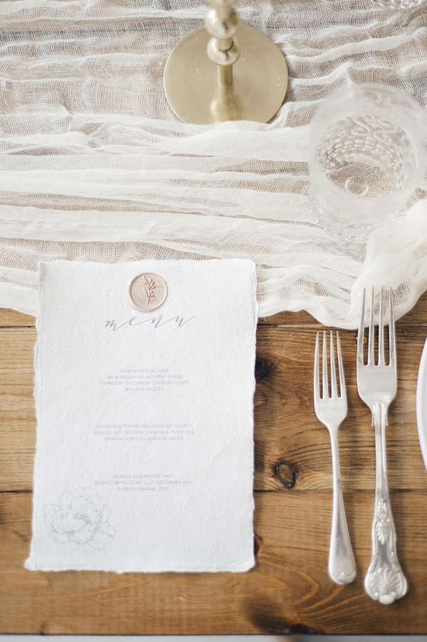 Place setting design with elegant menu and silver cutlery