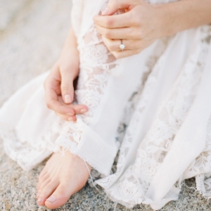 Vintage lace wedding dress on a barefoot bride