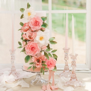 wedding cake decorated with elaborate sugar flowers