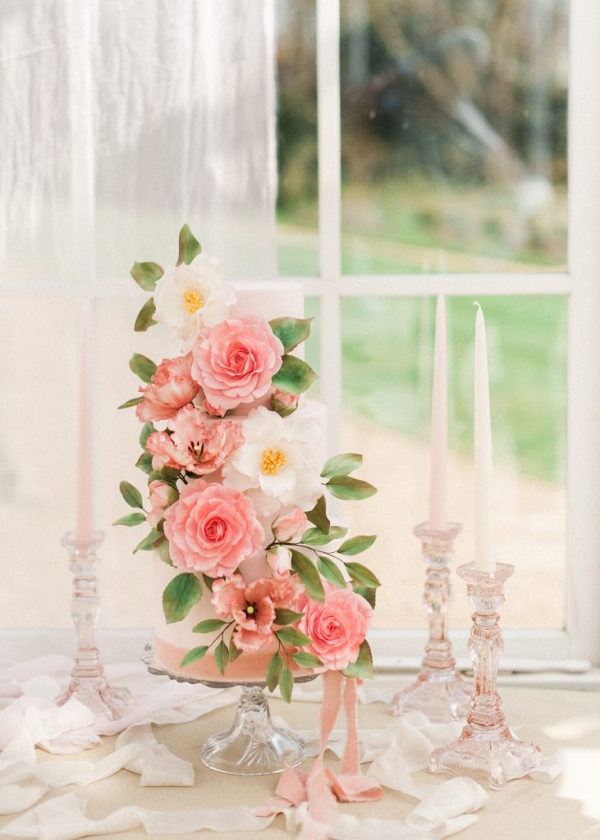 wedding cake decorated with elaborate sugar flowers