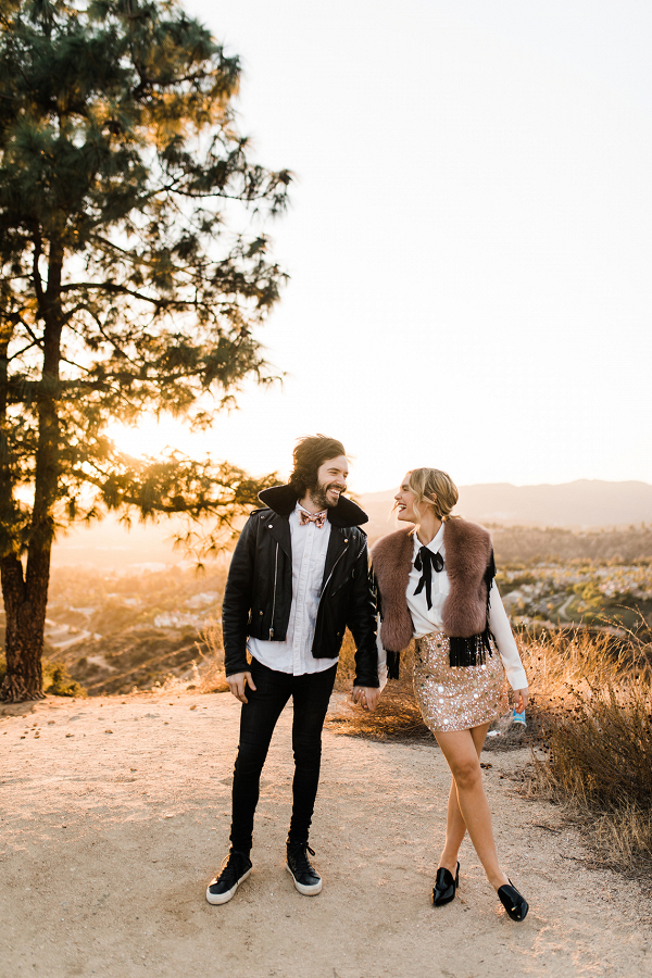 couple in the LA Hills wearing matching outfits for their engagement session