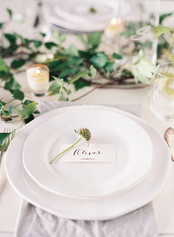 place setting with florals and foliage as a table runner