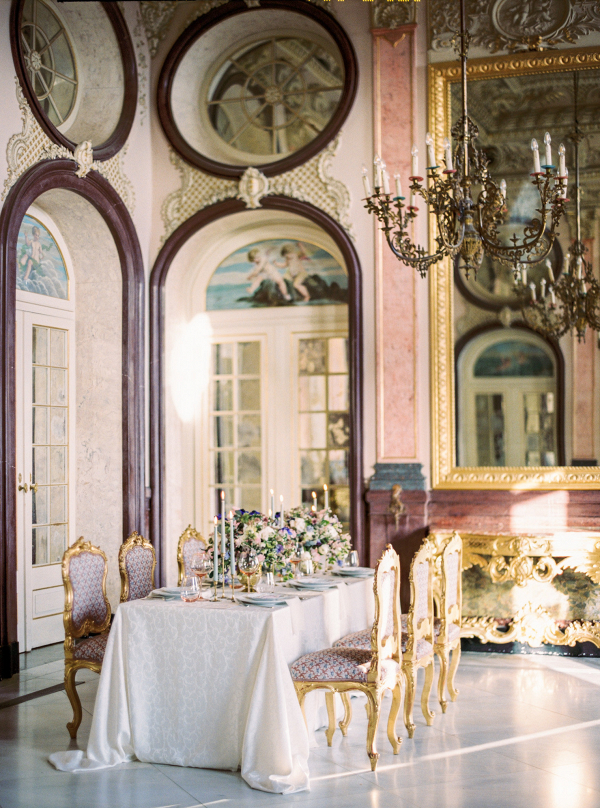 inside the palace of estoi and an elegant wedding tablescape design with gold chairs