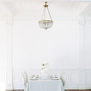 white ballroom with wedding table setting