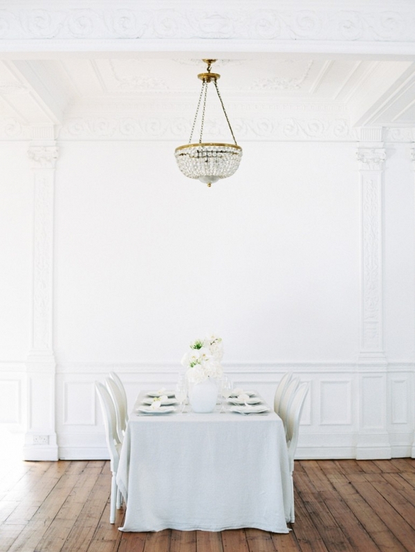 white ballroom with wedding table setting