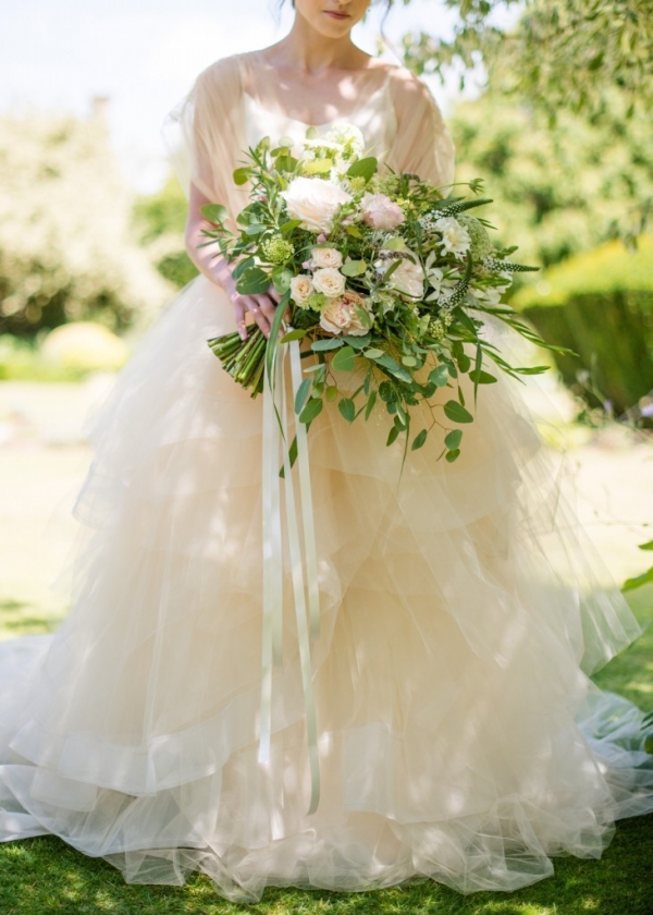 Wild organic summer wedding bouquet with garden roses and trailing ribbons