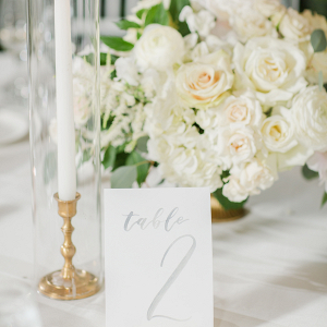 tall candlesticks and elegant white floral centrepieces