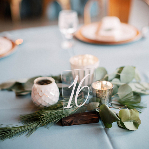 Hand lettering acrylic table number with greenery 