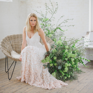 The Theia Emma wedding dress in ombre white to pink covered in silk petals